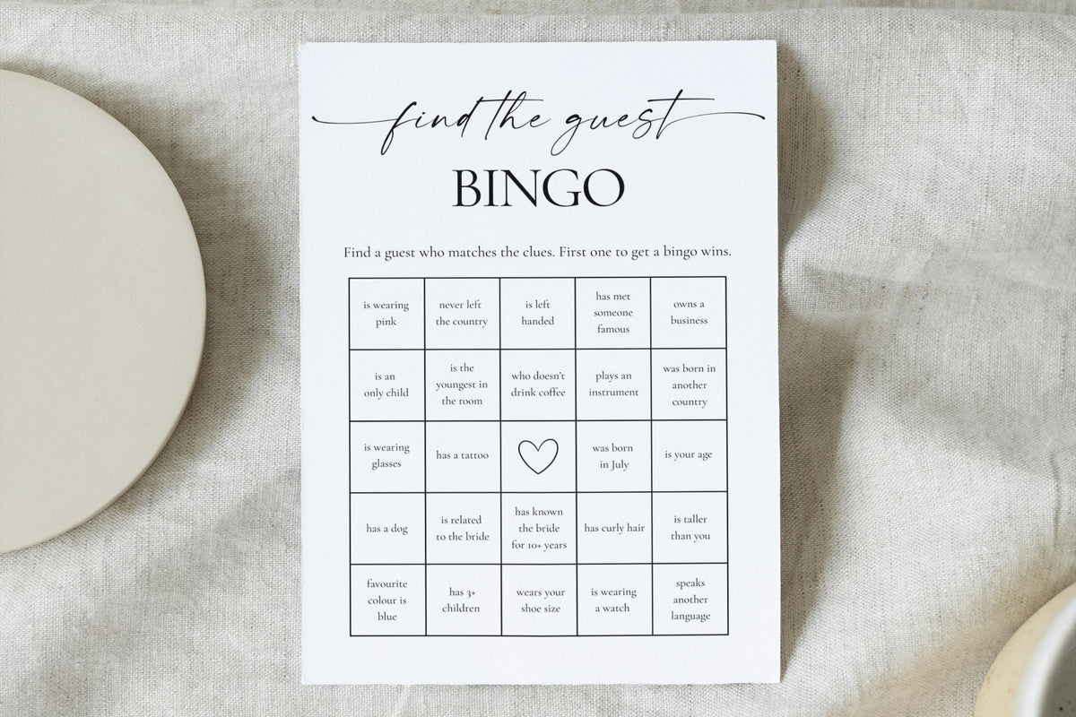 Neutral linen flat lay with black and white guest bingo card - editable bridal shower game for classy weddings or hens parties