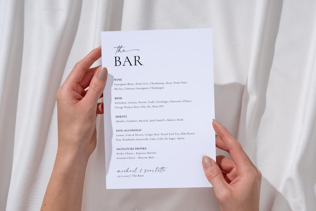 Bride holding minimalist wedding drink menu sign, editable in Canva with personalised drink list, beer, wine, and custom signature cocktails