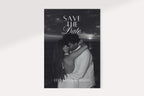 Black and white photo save the date card design featuring a kissing couple, elegant serif and script lettering, and names at the bottom for a romantic old money wedding announcement.