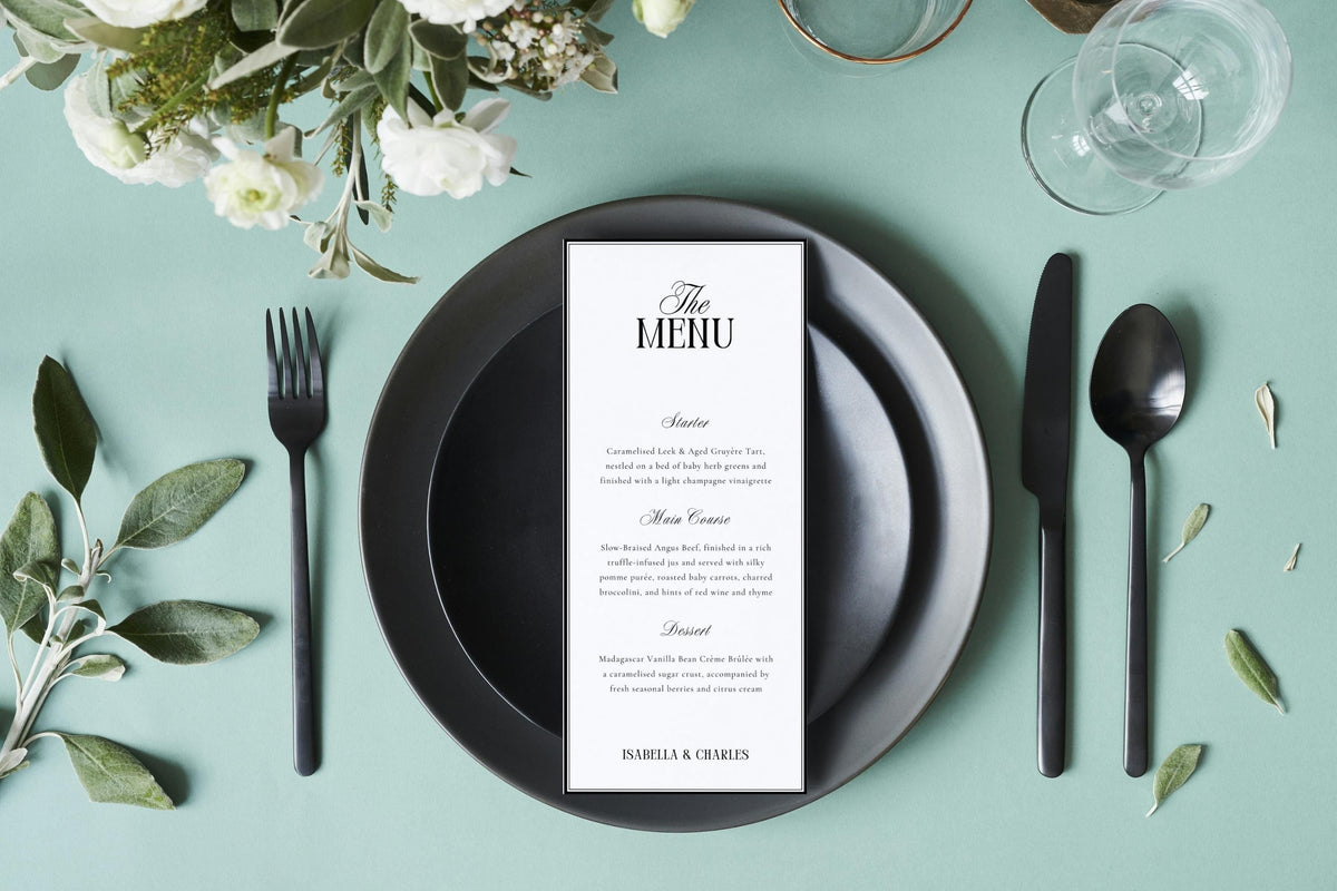 Minimalist tall wedding menu card on modern black plate with soft greenery, editable old money style wedding menu template, printable 4x9 menu design for elegant reception table décor.