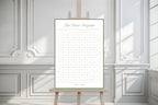 Printable First Dance Sweepstake wedding sign with a fine sage border, displayed on a wooden easel in a light, elegant indoor setting.