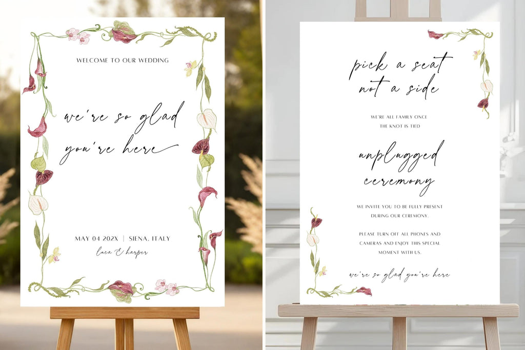 Matching botanical wedding signs displayed on easels, featuring romantic script lettering and burgundy floral accents.