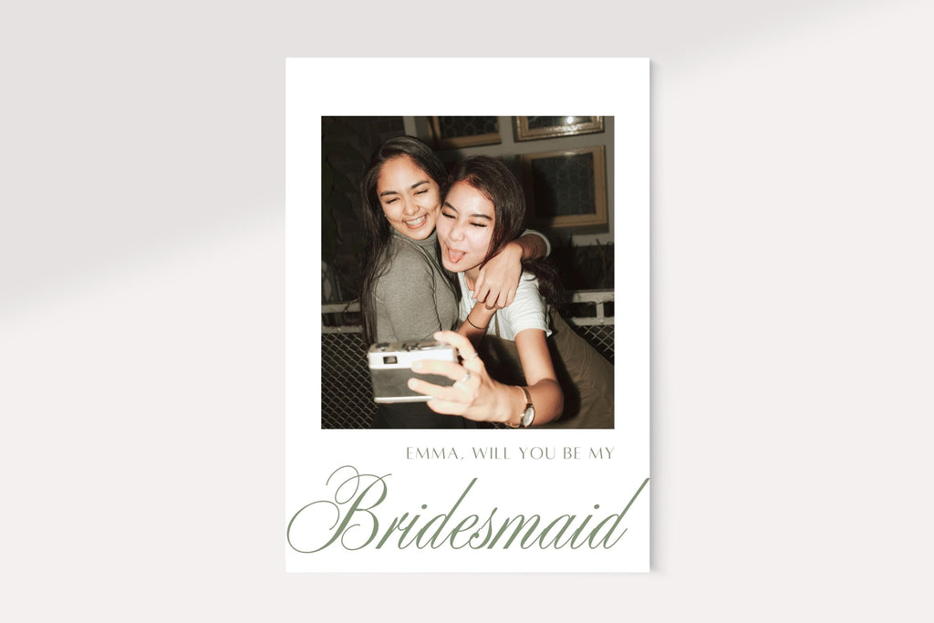 Photo bridesmaid proposal card front with a white border, personalised name and sage green will you be my bridesmaid lettering. Minimalist printable bridal party proposal card with elegant oversized script.