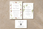 Burgundy floral wedding invitation suite with coordinating invitation, wedding details card and RSVP card, featuring botanical borders, elegant script and green foliage on a neutral stone background.