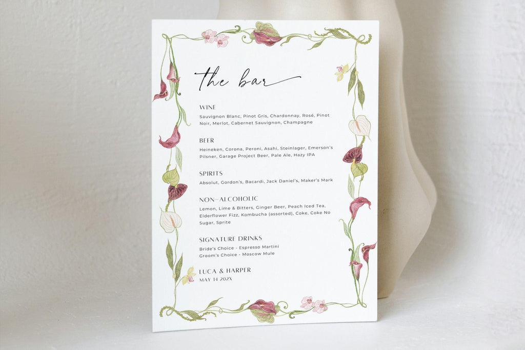 Editable floral wedding bar menu template with drinks listed beneath “the bar” heading, framed by delicate pink flowers and green foliage for elegant reception drinks signage.