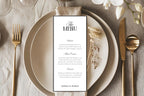 Elegant wedding menu card displayed on beige ceramic plates with gold flatware, editable old money wedding menu template, printable tall 4x9 reception menu with serif and script fonts.