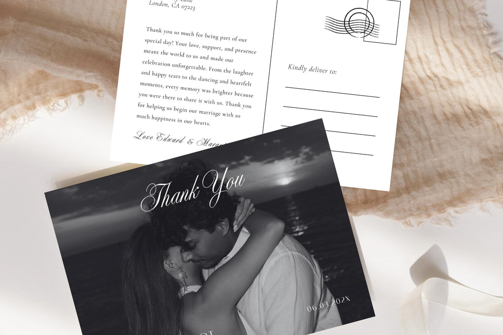 Close-up of a romantic photo wedding thank you postcard template with script lettering, personalised names and an ivory address-side reverse, arranged with cream ribbon and textured fabric.