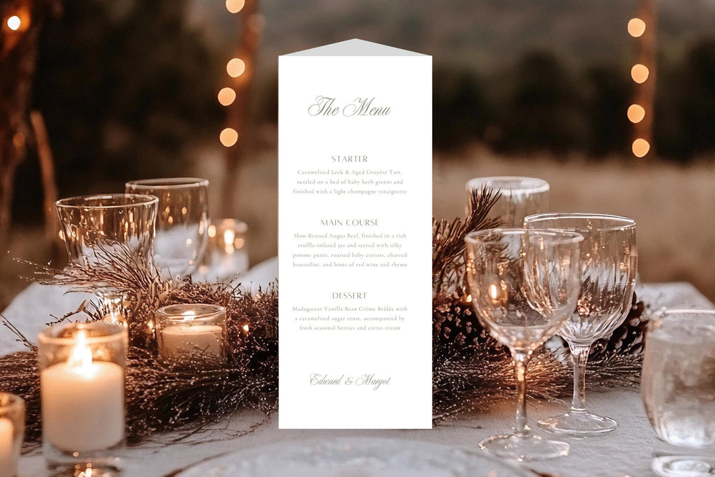 Elegant wedding menu panel on a trifold reception table card, styled with glowing candles and crystal glasses, featuring delicate sage green lettering and an ivory background for a romantic wedding.