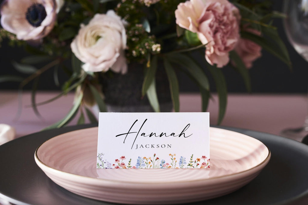 Elegant wildflower place card template displayed on wedding dinner plate, printable escort card, rustic boho floral table name cards