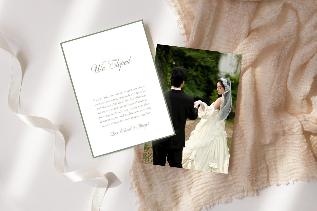 Two-sided elopement announcement card template displayed as a flat lay, with a sage bordered “We Eloped” message card and a wedding photo card on cream fabric.