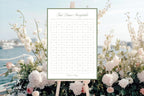 Sage green First Dance Sweepstake wedding sign displayed among pale flowers beside the coast, styled for a beach wedding reception.