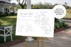 Sage green wedding crossword sign for guest entertainment on an easel outdoors, with a badge explaining that the heading can be kept or removed.