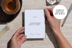 Sage green table seven wedding sign held above a stone tabletop, featuring romantic script and a minimalist green border, with size options shown for a printable wedding reception table number template.