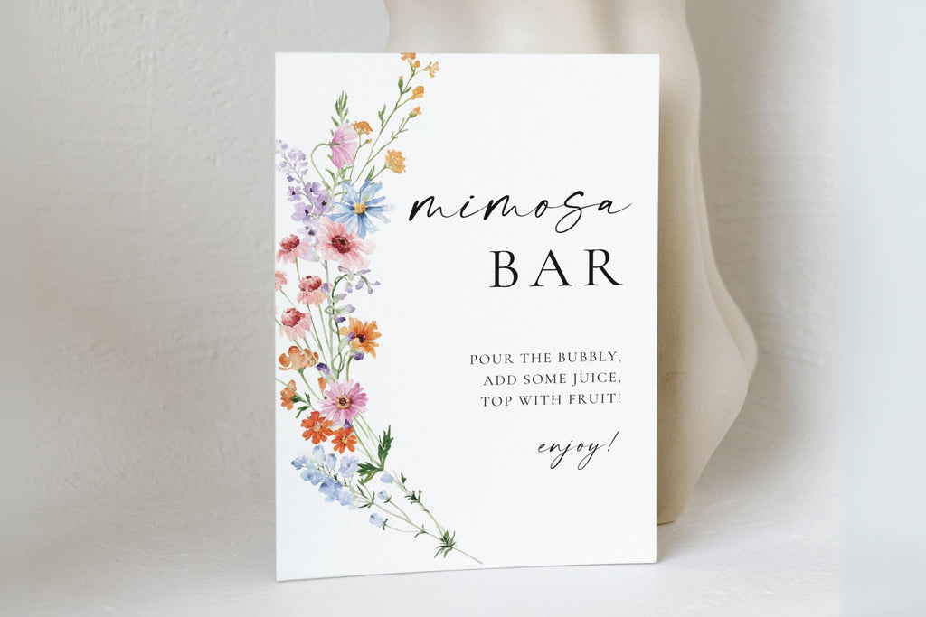 Love in Bloom wildflower mimosa bar sign template displayed on table, printable wedding bar sign with floral design, editable Canva bridal shower décor