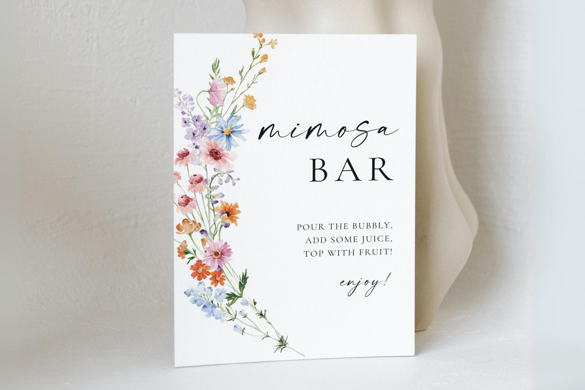 Love in Bloom wildflower mimosa bar sign template displayed on table, printable wedding bar sign with floral design, editable Canva bridal shower décor