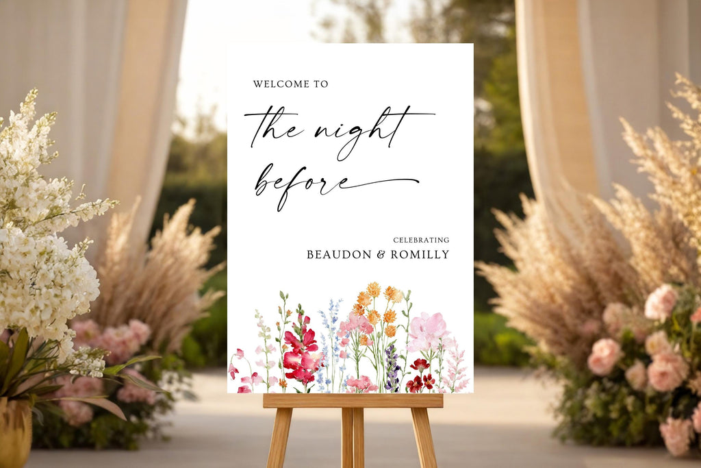 Elegant floral rehearsal dinner sign mockup on an easel, styled with soft pink and white wedding flowers.