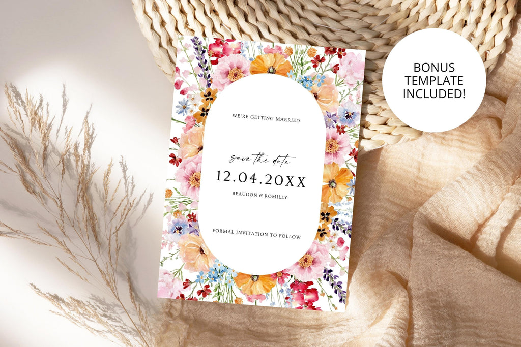 Close-up of a colourful oval floral wedding save the date template with a bonus template badge, styled on neutral woven fabric.