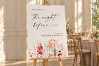 Floral rehearsal dinner sign mockup displayed on an easel in an elegant indoor wedding venue with warm neutral décor.