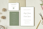 Classic sage green and white wedding invitation set with elegant script typography, matching details insert and QR code RSVP card, displayed with envelopes, decorative wax seals and gold scissors.