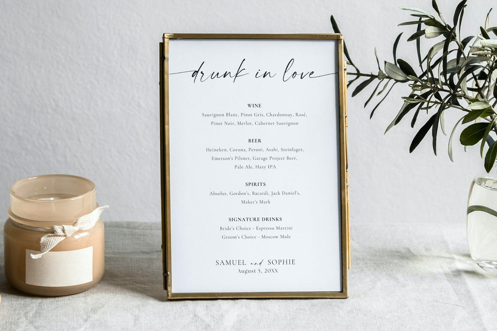 Modern minimalist thank you wedding sign in gold frame with candle styling, clean neutral wedding décor, editable Canva printable wedding signage template