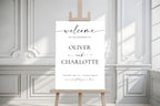 Minimalist wedding welcome sign on white easel in elegant venue space editable printable wedding poster template modern reception sign