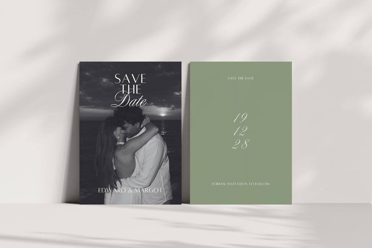 Minimalist sage green wedding save the date template shown front and back, with monochrome couple photography and white script date, displayed upright in natural light with soft shadows.