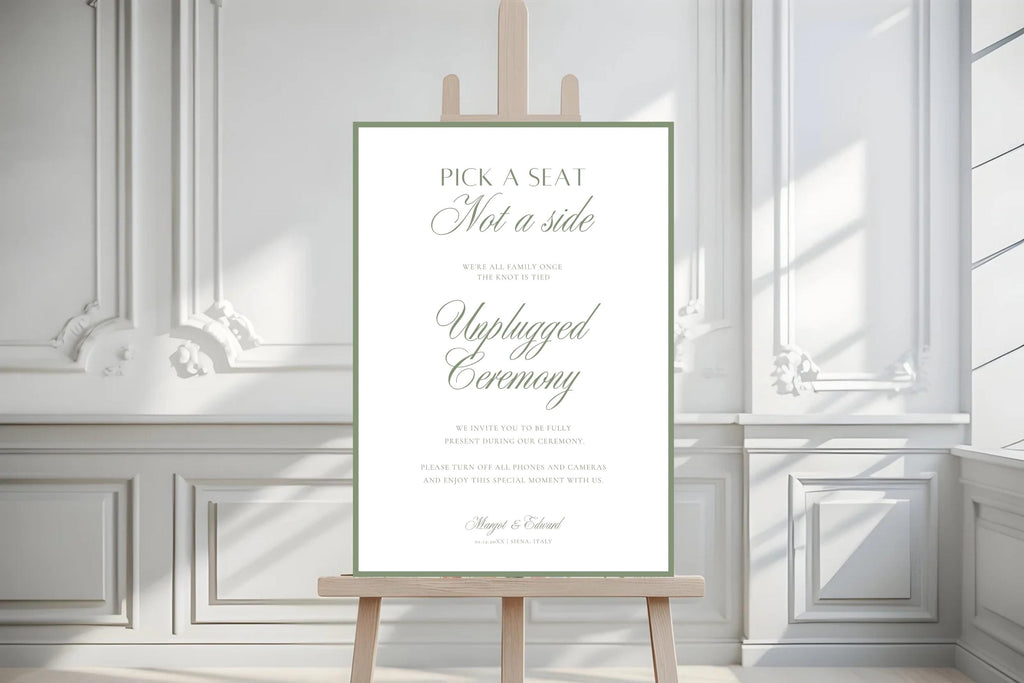 Minimalist sage green wedding seating sign on a wooden easel against white panelled walls, with refined typography and “Pick a seat, not a side” wording.