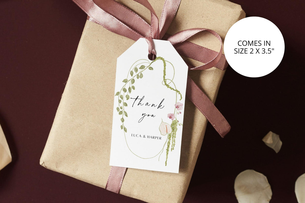 Editable 2 x 3.5 inch wedding favour tag tied to a neutral gift box with ribbon, featuring delicate green botanical artwork.