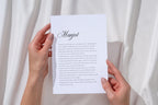 Personalised wedding vows keepsake print held in two hands against soft white curtains, featuring an elegant script name and minimalist vow wording for a meaningful newlywed gift.