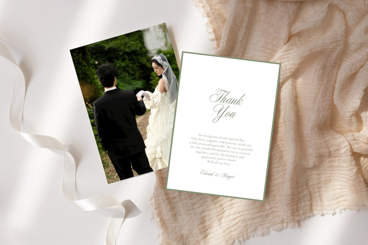 Printable wedding photo thank you card template with a sage green bordered message design, styled beside a bride and groom photograph on soft neutral fabric with flowing white ribbon.