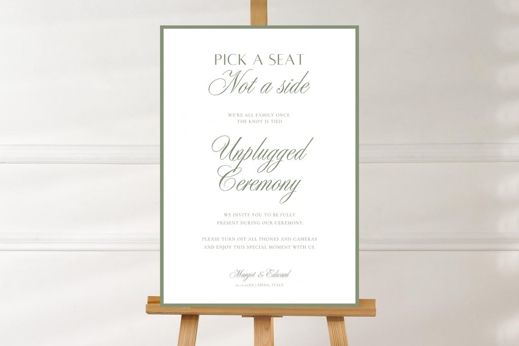 Simple sage green open seating wedding sign on a wooden easel against a soft white background, showing the full design and elegant ceremony wording.
