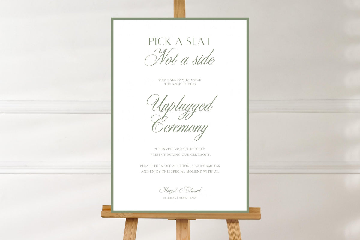 Simple sage green open seating wedding sign on a wooden easel against a soft white background, showing the full design and elegant ceremony wording.