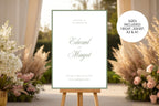 Sage green wedding welcome sign on an easel beside soft pink flowers and dried grasses in warm natural light. Romantic wedding entrance template with a size label showing 18x24, 20x30 inches, A2 and A1 options.
