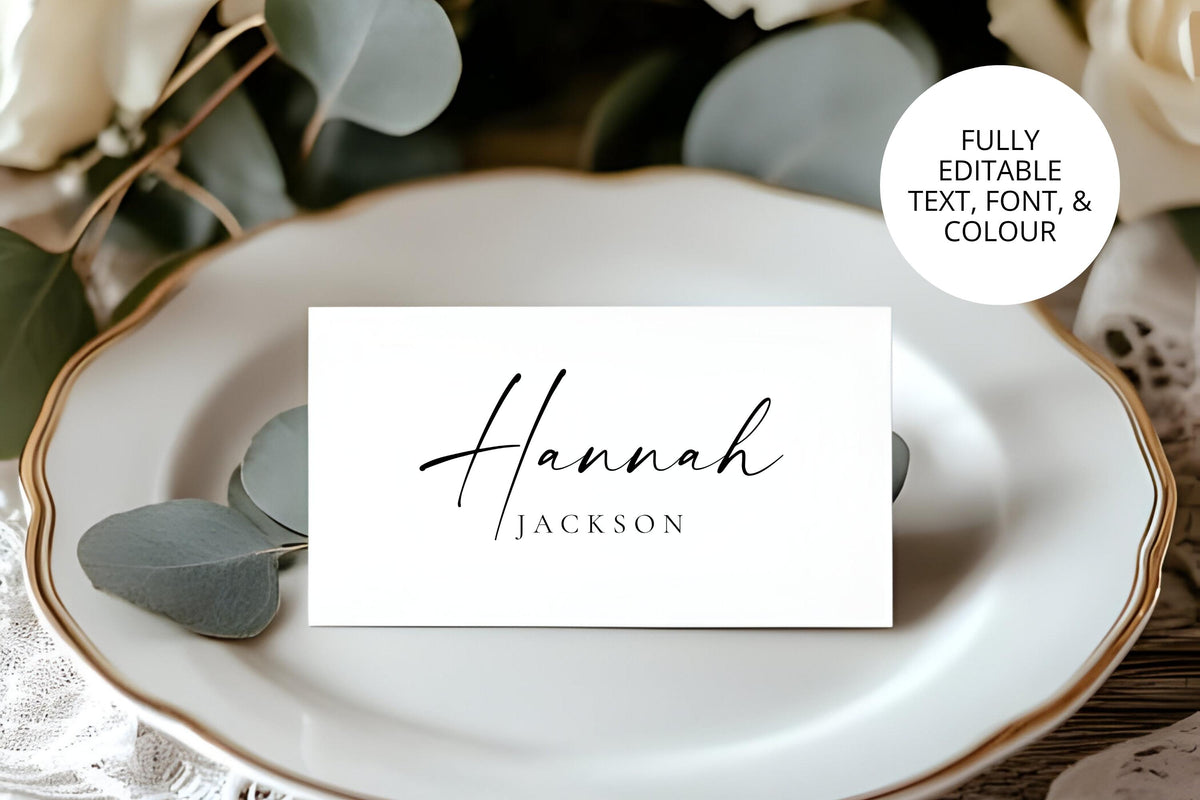 Elegant printable wedding place cards in black and white with editable text and font, displayed on classic gold-rimmed plate