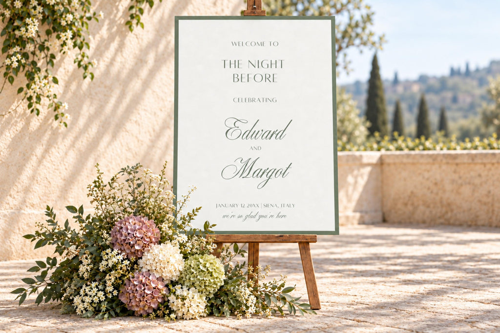 Old money rehearsal dinner welcome sign with sage green border and elegant script names, displayed on a wooden easel beside pastel wedding flowers on a sunlit terrace. Printable “The Night Before” wedding signage.