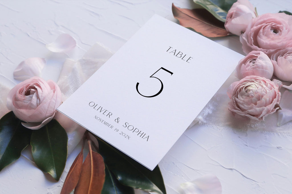 Flat lay wedding table number printable, table 5 sign with blush roses, romantic wedding table decor, editable Canva template, minimalist wedding stationery aesthetic
