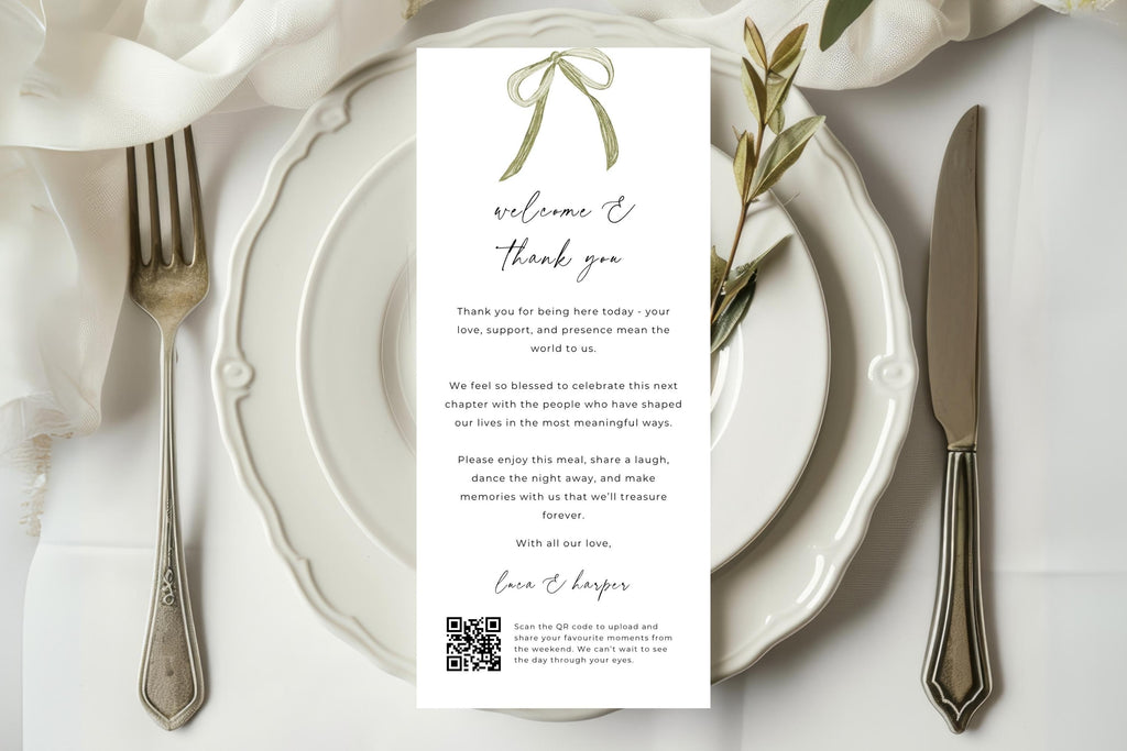 Editable wedding thank you letter template with a sage green bow, elegant script and QR code, displayed on ivory plates with silver cutlery and soft linen for a romantic wedding reception place setting.