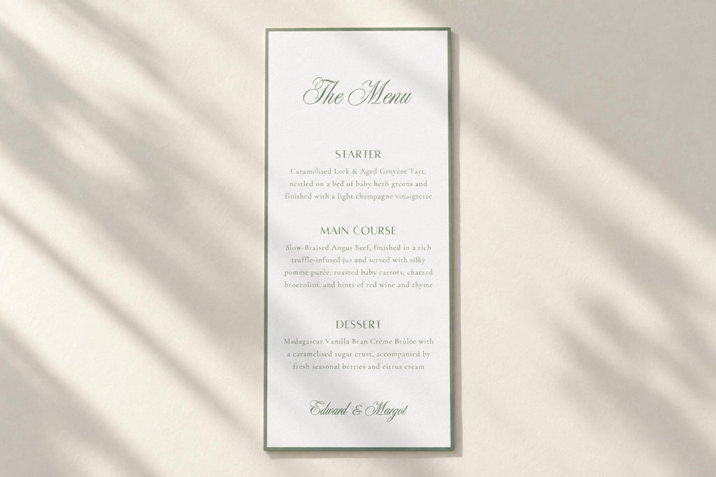 Minimalist sage green wedding menu card on a plain ivory background with soft sunlight and shadows, featuring a script heading, refined serif text and slim border for timeless old money wedding stationery.