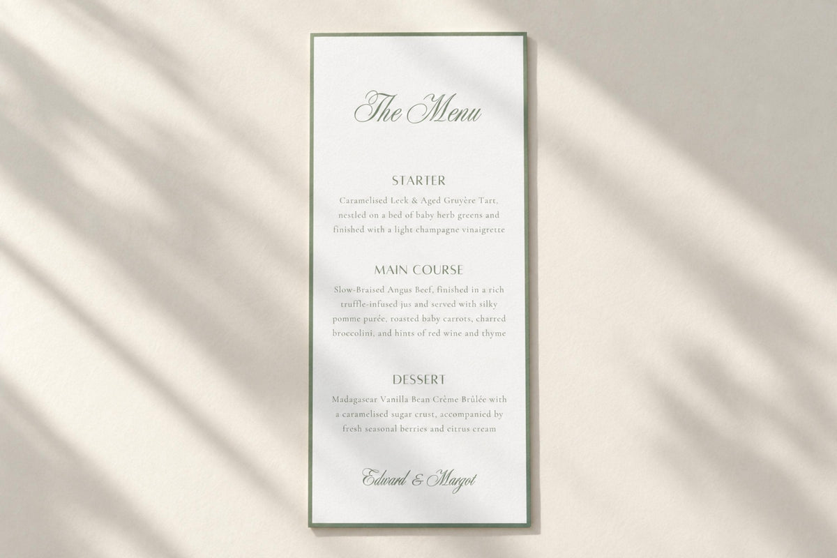 Minimalist sage green wedding menu card on a plain ivory background with soft sunlight and shadows, featuring a script heading, refined serif text and slim border for timeless old money wedding stationery.