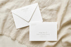 Sage green wedding envelope addressing template with elegant script and serif lettering, showing guest address front and return address flap on ivory envelopes styled on cream linen for an old money wedding.