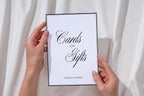 Hands holding Cards and Gifts wedding sign against white fabric, minimalist printable wedding sign, editable Canva wedding signage for reception gift table.