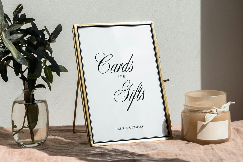 Old Money style Cards and Gifts wedding sign in gold frame on elegant table with olive branches and candle, editable Canva template for wedding reception stationery.
