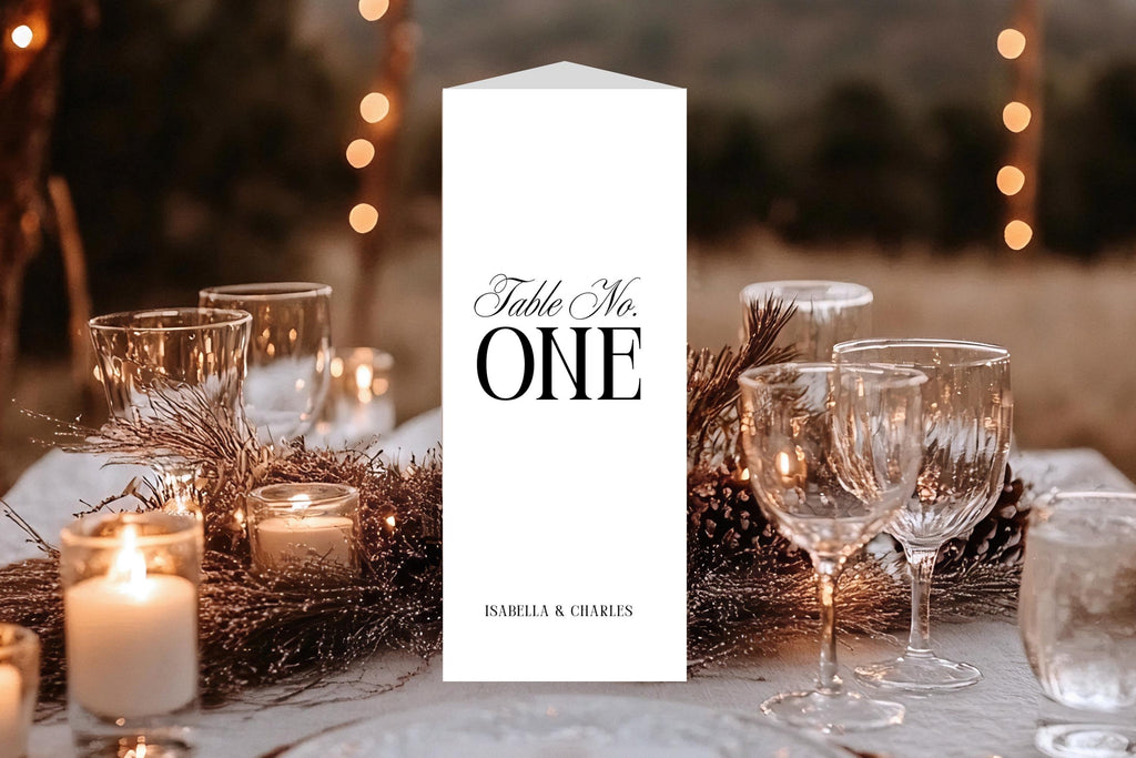 Elegant trifold wedding table number with menu and bar layout displayed on a candlelit reception table, classic old money wedding stationery style, minimalist black and white table decor printable