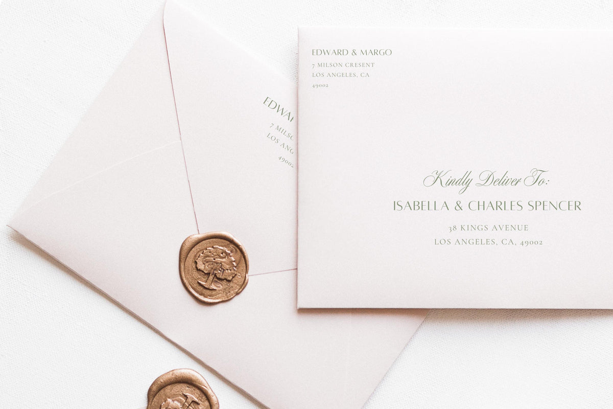 Elegant wedding envelope address template with sage green calligraphy and classic serif text, styled with ivory envelopes and a gold wax seal for romantic wedding invitation stationery.