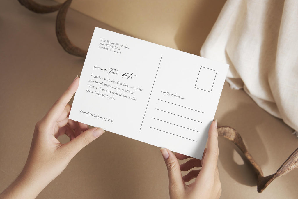 Elegant modern save the date postcard template held in hands, showcasing editable Canva wedding stationery design for couples’ engagement announcement.