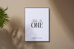 Editable minimalist wedding table number sign shown in neutral beige mockup, black serif table number template for elegant modern wedding reception décor, printable Canva table card.