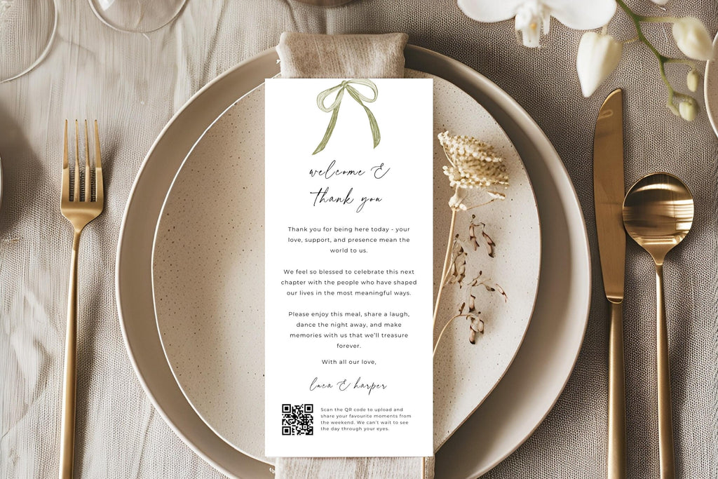 Printable wedding reception thank you letter with a sage green ribbon bow, displayed on layered neutral plates with gold cutlery and beige linen. Elegant editable wedding table stationery for each guest’s place setting.
