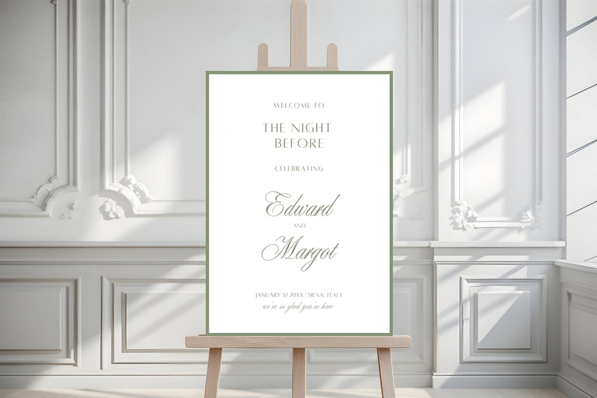 Elegant rehearsal dinner welcome sign on a wooden easel in a light-filled room with decorative wall panelling. White and sage green wedding eve signage with personalised script names and timeless old money styling.