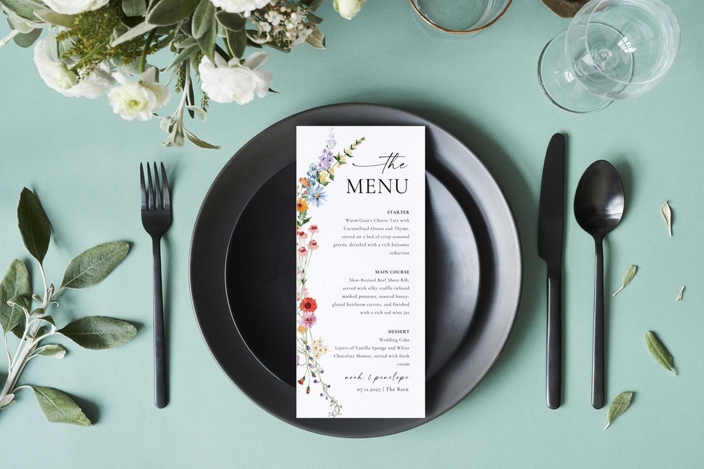 Printable wildflower wedding menu card on sage green table with black cutlery, boho floral reception dinner menu editable Canva template